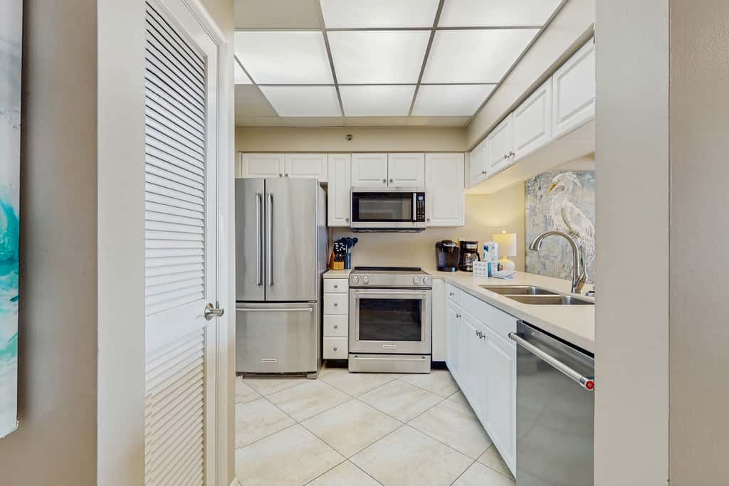 Open-concept beachfront home with balcony, lagoon pool, beach access, pickleball
