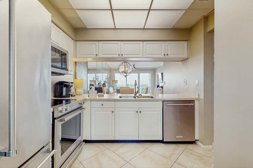 Open-concept beachfront home with balcony, lagoon pool, beach access, pickleball