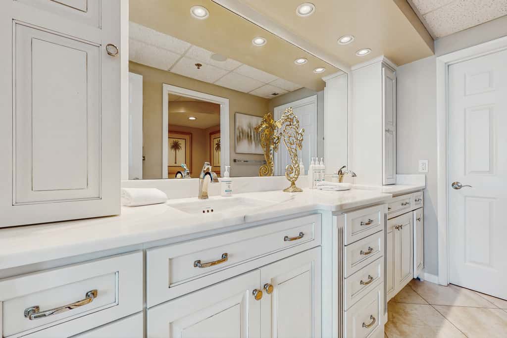 Open-concept beachfront home with balcony, lagoon pool, beach access, pickleball