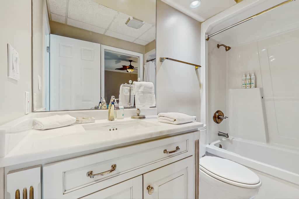Open-concept beachfront home with balcony, lagoon pool, beach access, pickleball