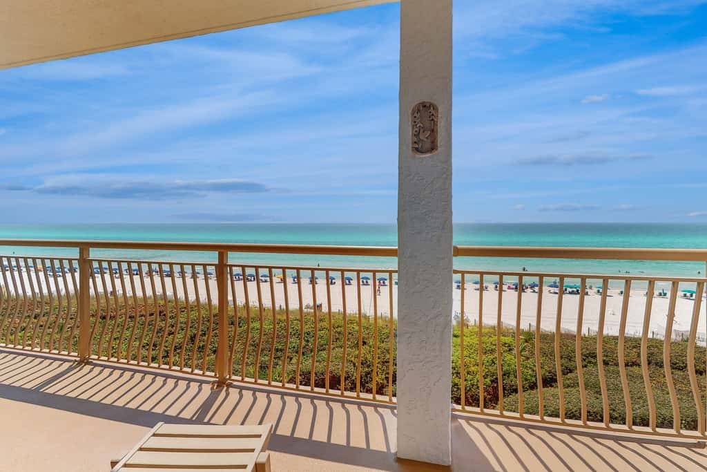 Open-concept beachfront home with balcony, lagoon pool, beach access, pickleball