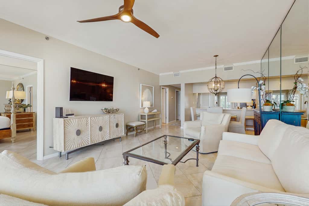 Open-concept beachfront home with balcony, lagoon pool, beach access, pickleball