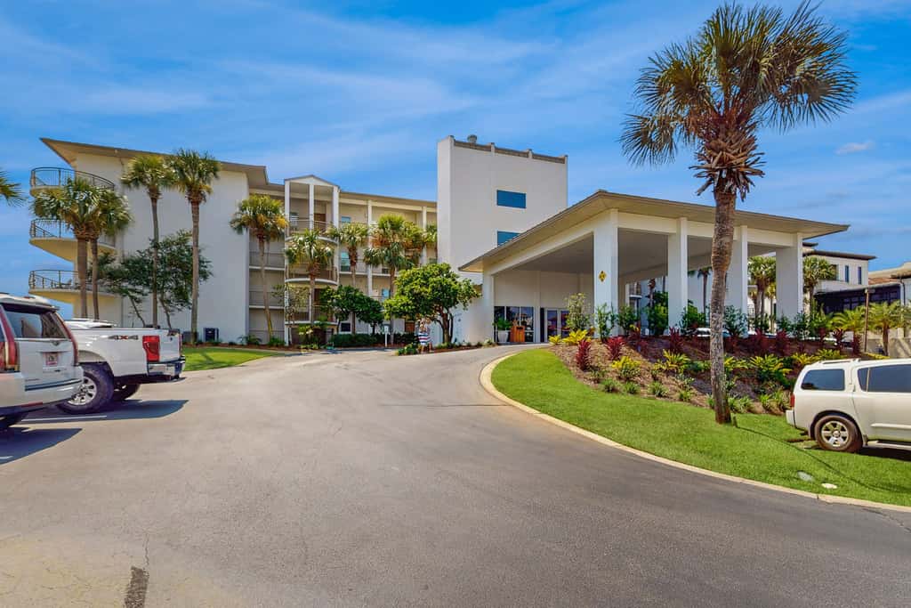 Open-concept beachfront home with balcony, lagoon pool, beach access, pickleball