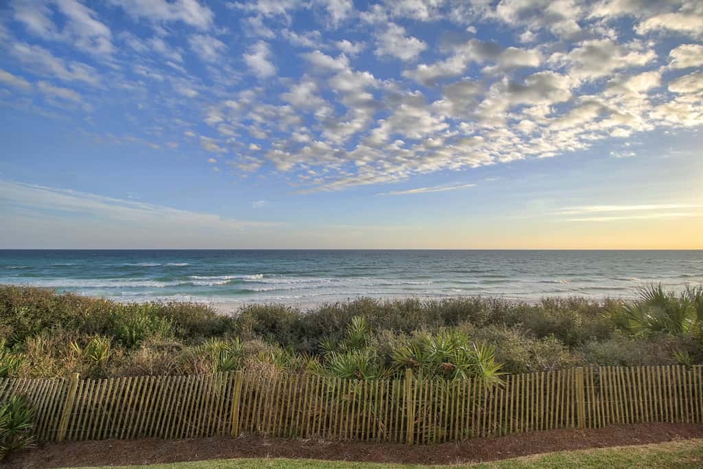 Open-concept beachfront home with balcony, lagoon pool, beach access, pickleball