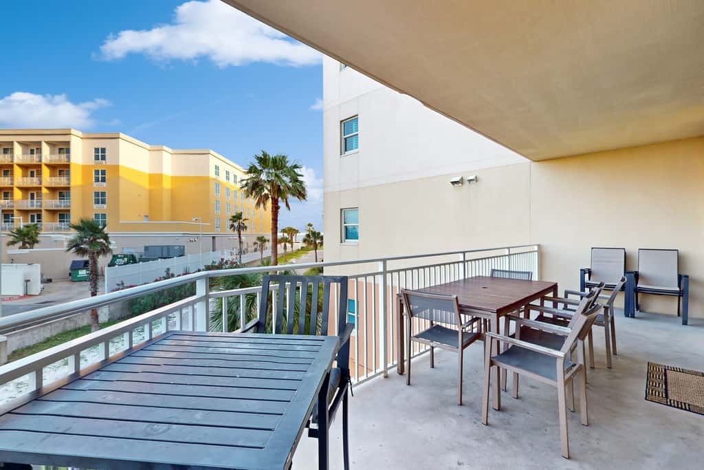 2nd-floor condo with balcony at Waterscape Waterfall, lazy river & beach chairs