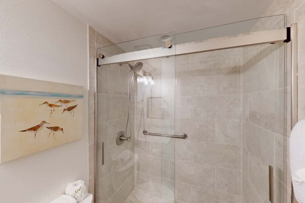 Coastal condo with beach, pool, hot tub, sauna, tennis, bikes, W&D, & central AC