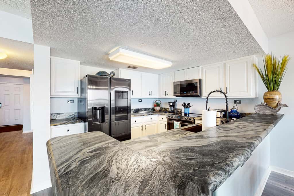 Beachfront condo with gulf views, pool, gym, & private balcony