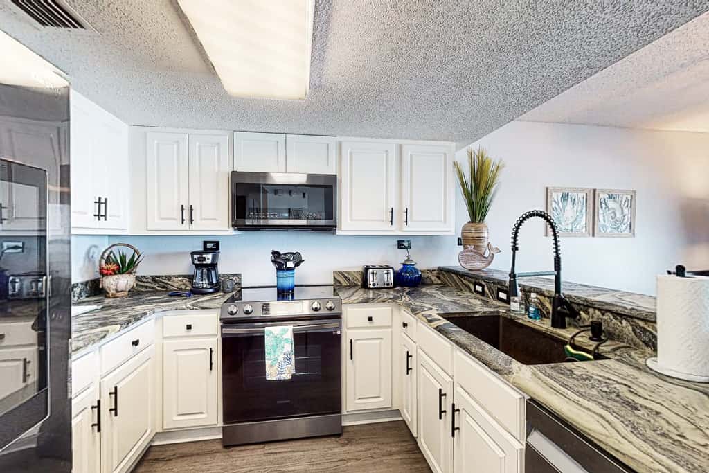 Beachfront condo with gulf views, pool, gym, & private balcony