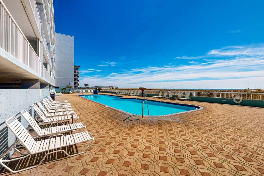 Beachfront condo with gulf views, pool, gym, & private balcony