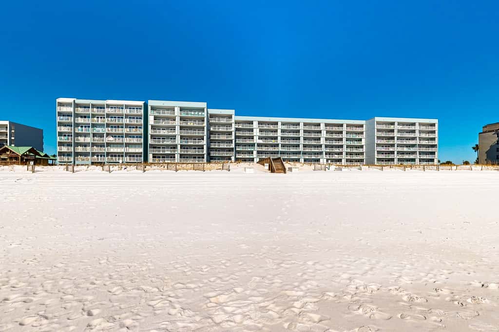 Beachfront condo with gulf views, pool, gym, & private balcony