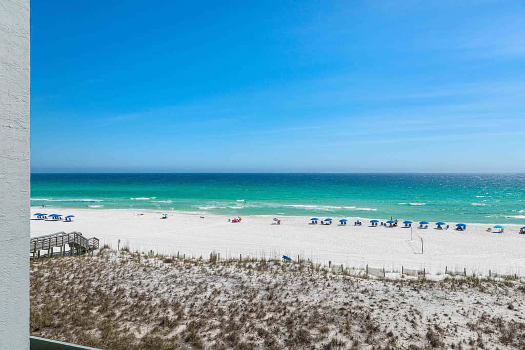 Beachfront condo with gulf views, pool, gym, & private balcony