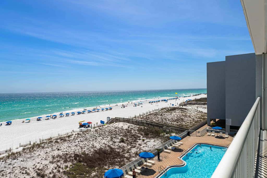 Beachfront condo with gulf views, pool, gym, & private balcony