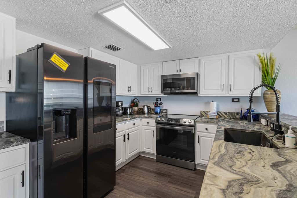 Beachfront condo with gulf views, pool, gym, & private balcony
