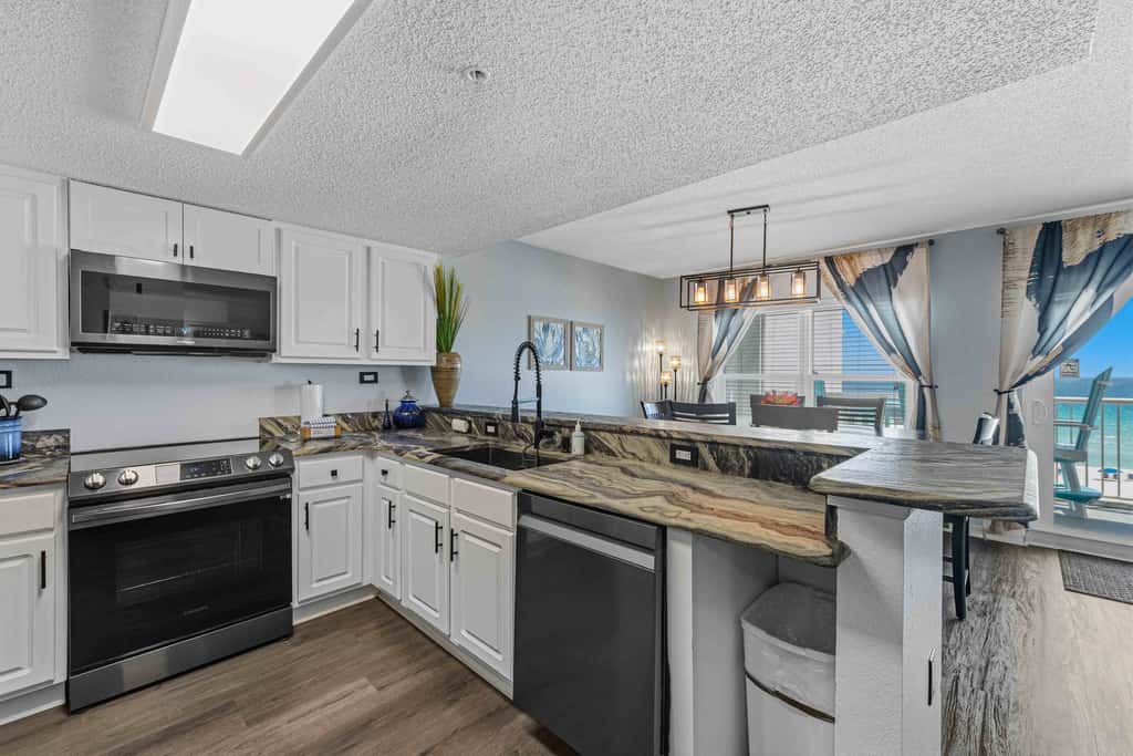 Beachfront condo with gulf views, pool, gym, & private balcony