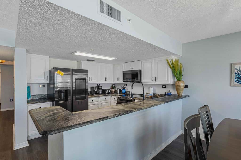 Beachfront condo with gulf views, pool, gym, & private balcony