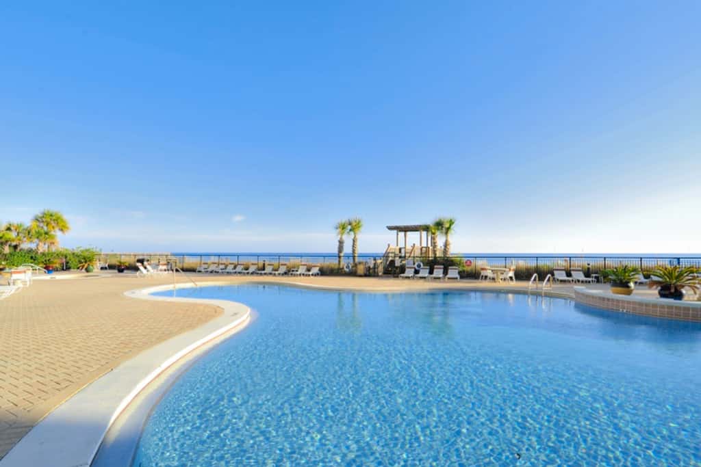 Gulf-front condo with pools, hot tub, beach access & views