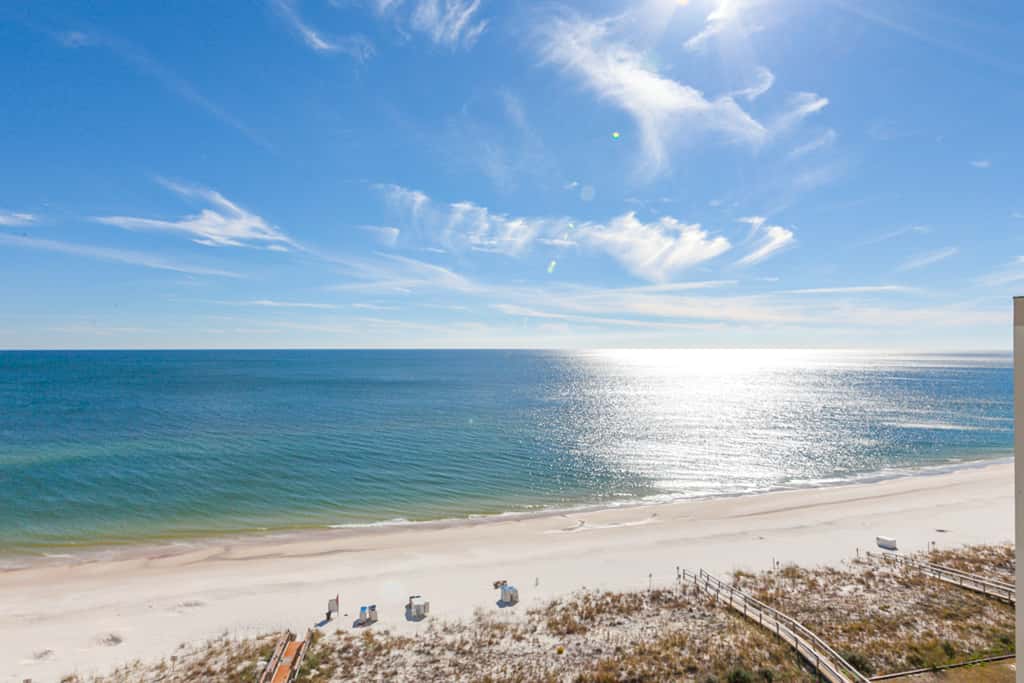 Gulf-front condo with pools, hot tub, beach access & views