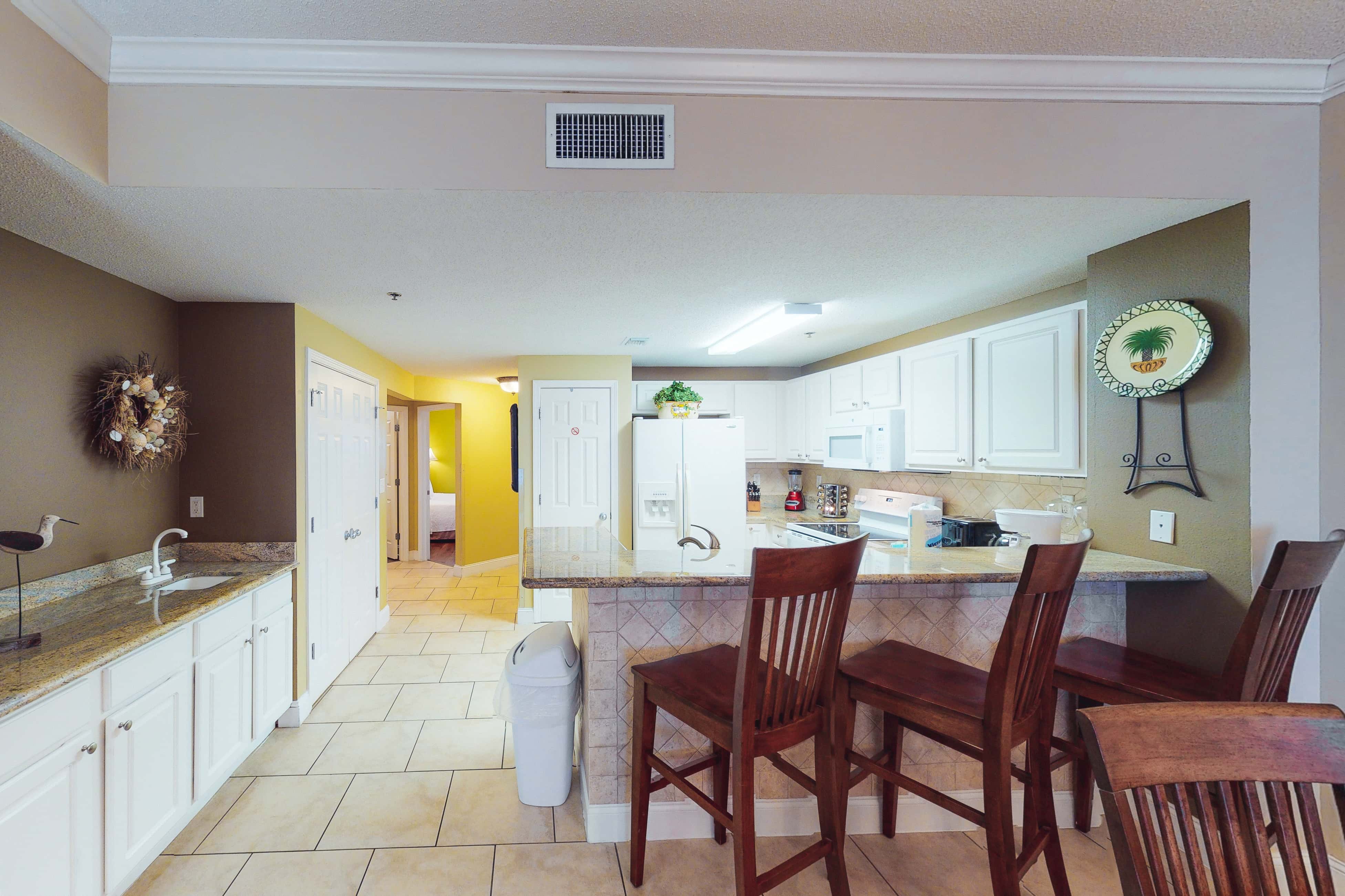 Coastal condo steps to beach with pools, hot tub, gym & amazing views