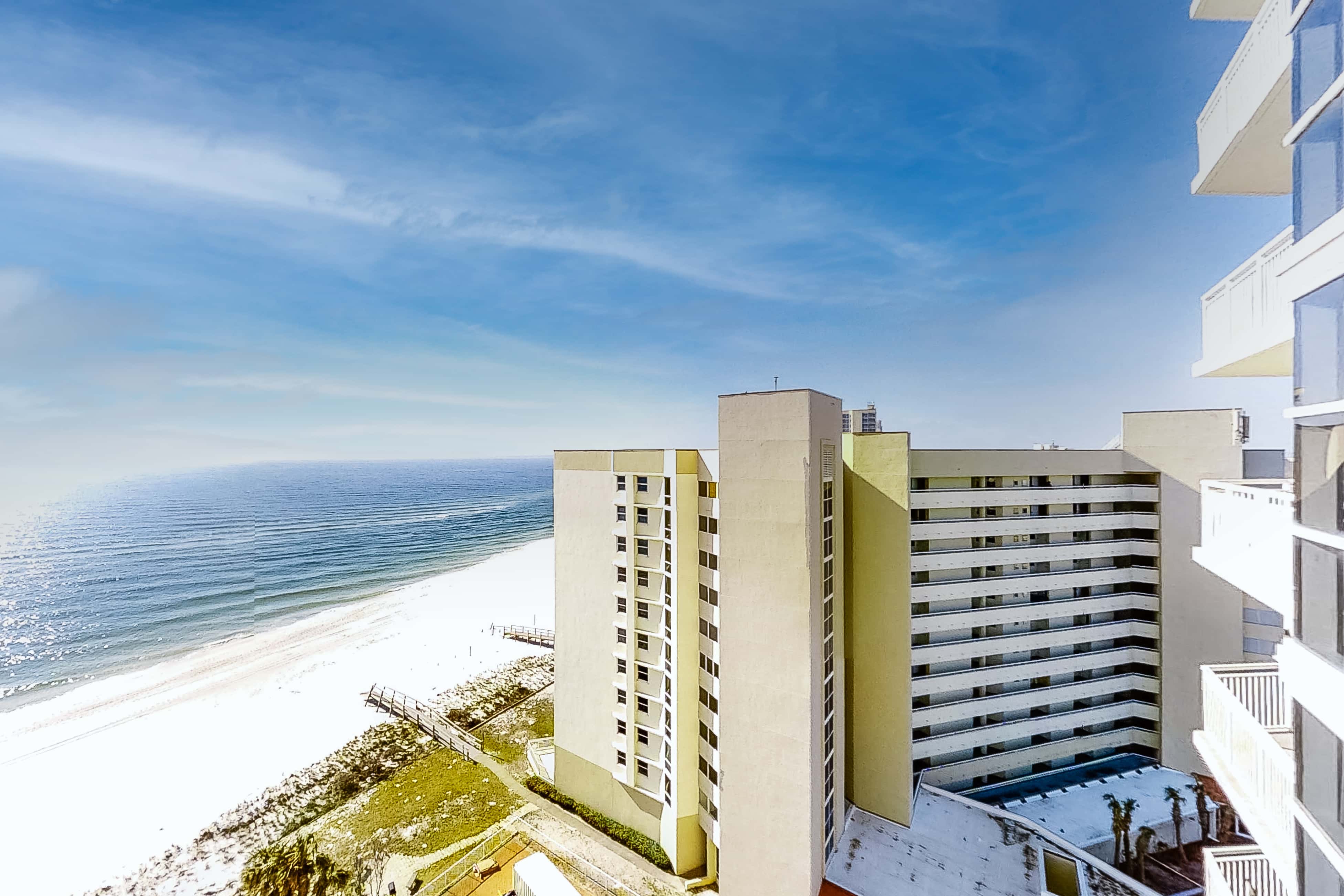 Coastal condo steps to beach with pools, hot tub, gym & amazing views