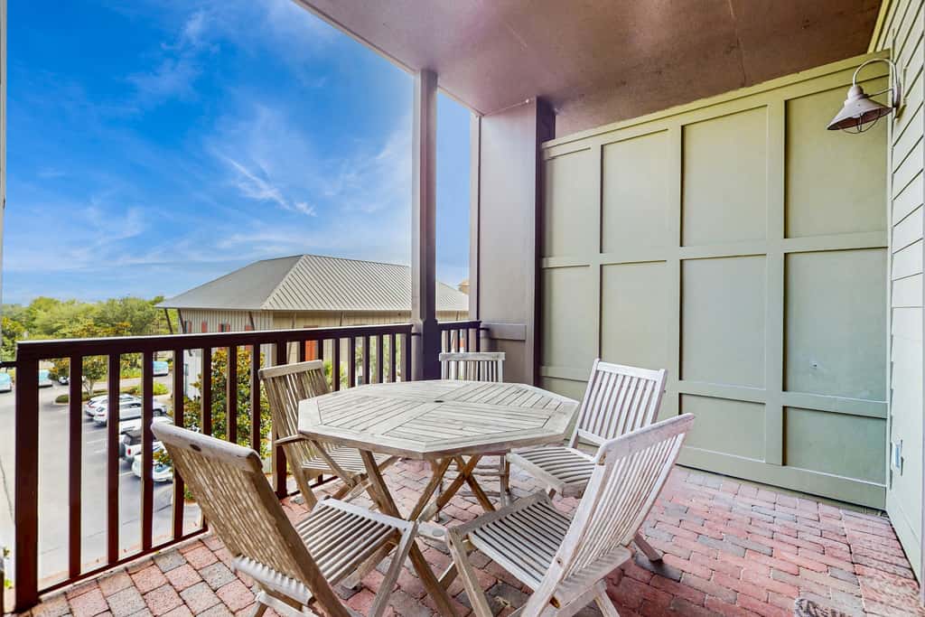 Polished condo with balcony & pools - one block from the beach