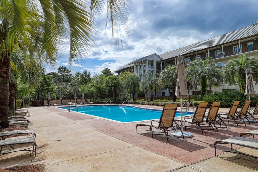 Polished condo with balcony & pools - one block from the beach