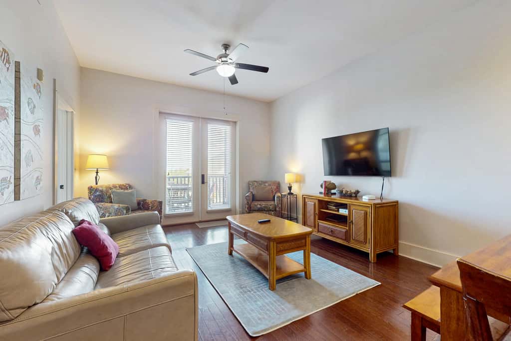 Polished condo with balcony & pools - one block from the beach