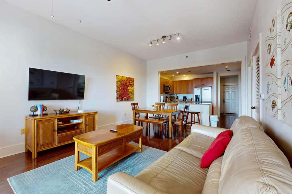 Polished condo with balcony & pools - one block from the beach