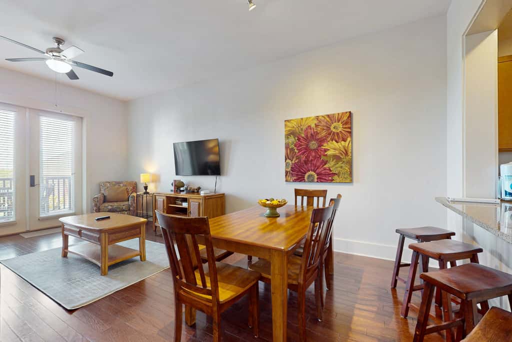 Polished condo with balcony & pools - one block from the beach