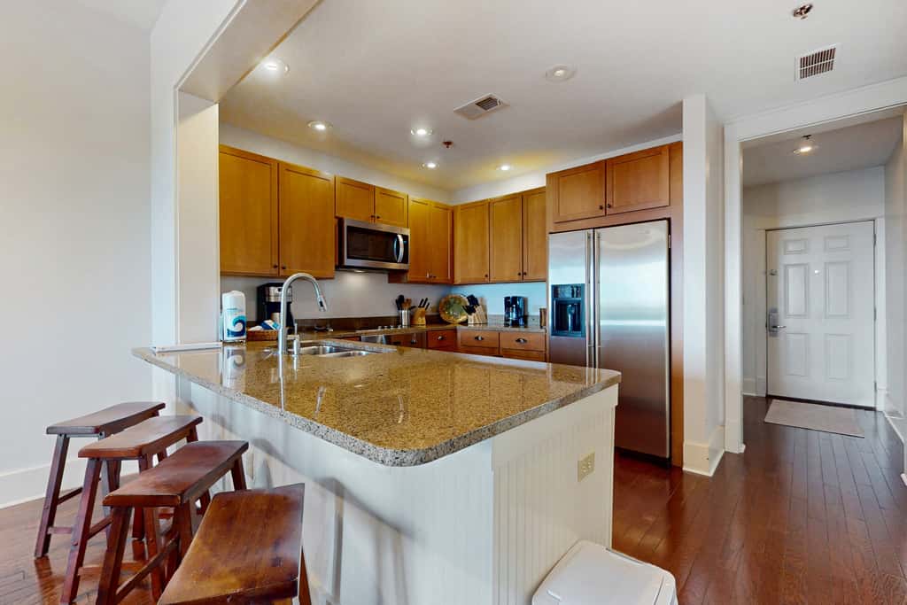 Polished condo with balcony & pools - one block from the beach