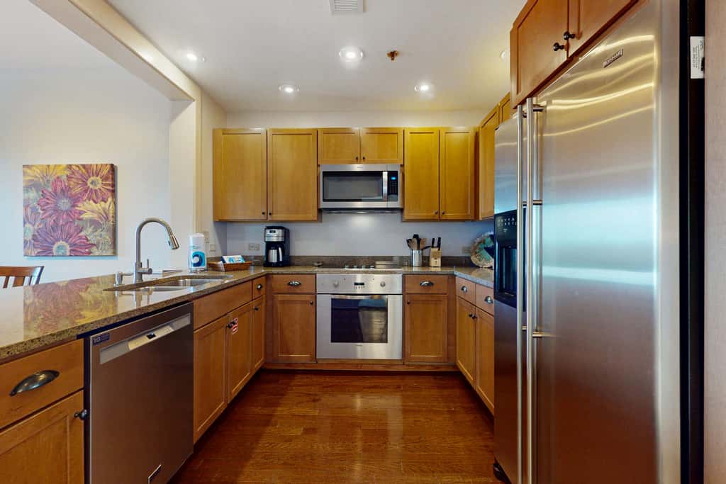 Polished condo with balcony & pools - one block from the beach
