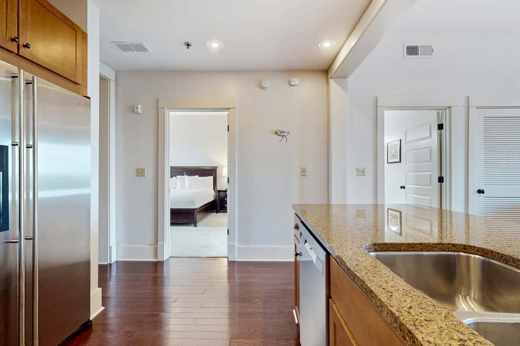 Polished condo with balcony & pools - one block from the beach