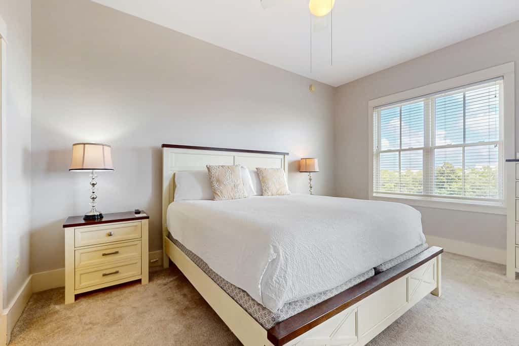 Polished condo with balcony & pools - one block from the beach