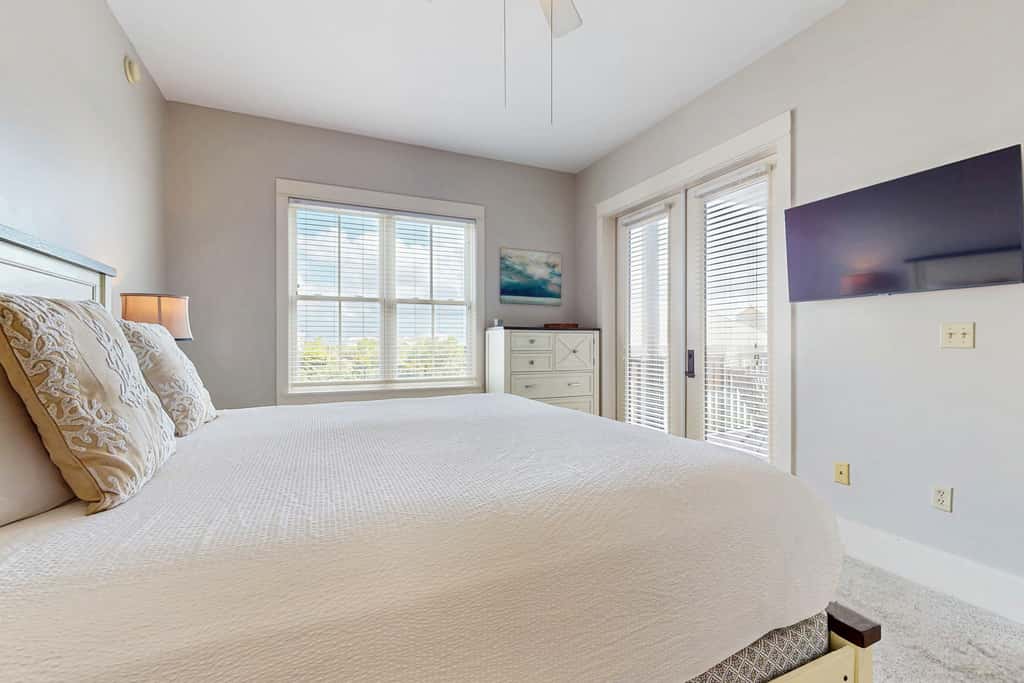 Polished condo with balcony & pools - one block from the beach