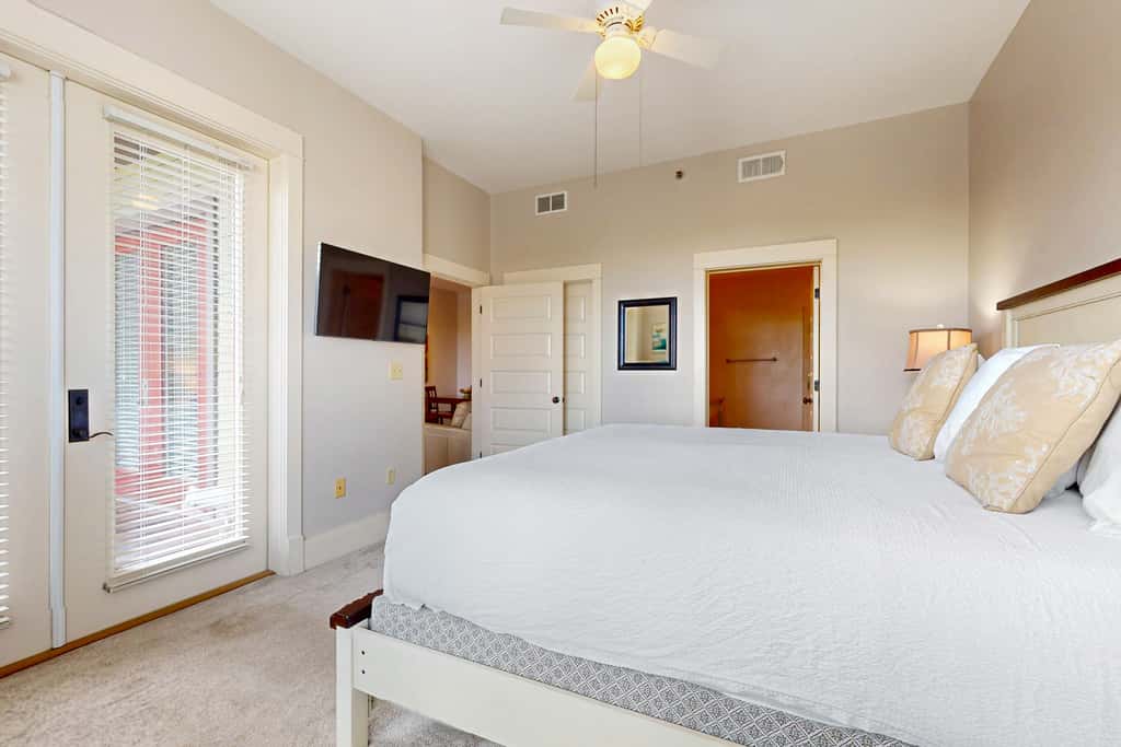 Polished condo with balcony & pools - one block from the beach