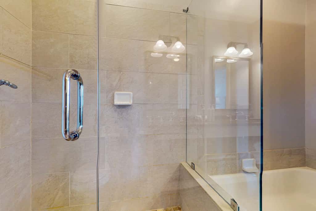 Polished condo with balcony & pools - one block from the beach