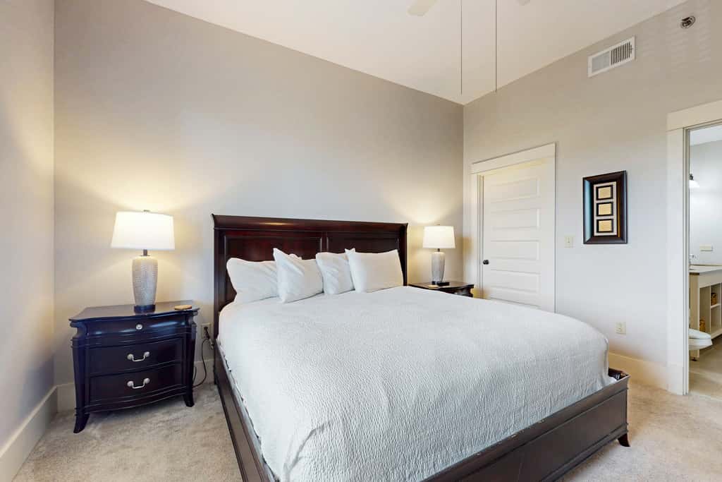 Polished condo with balcony & pools - one block from the beach