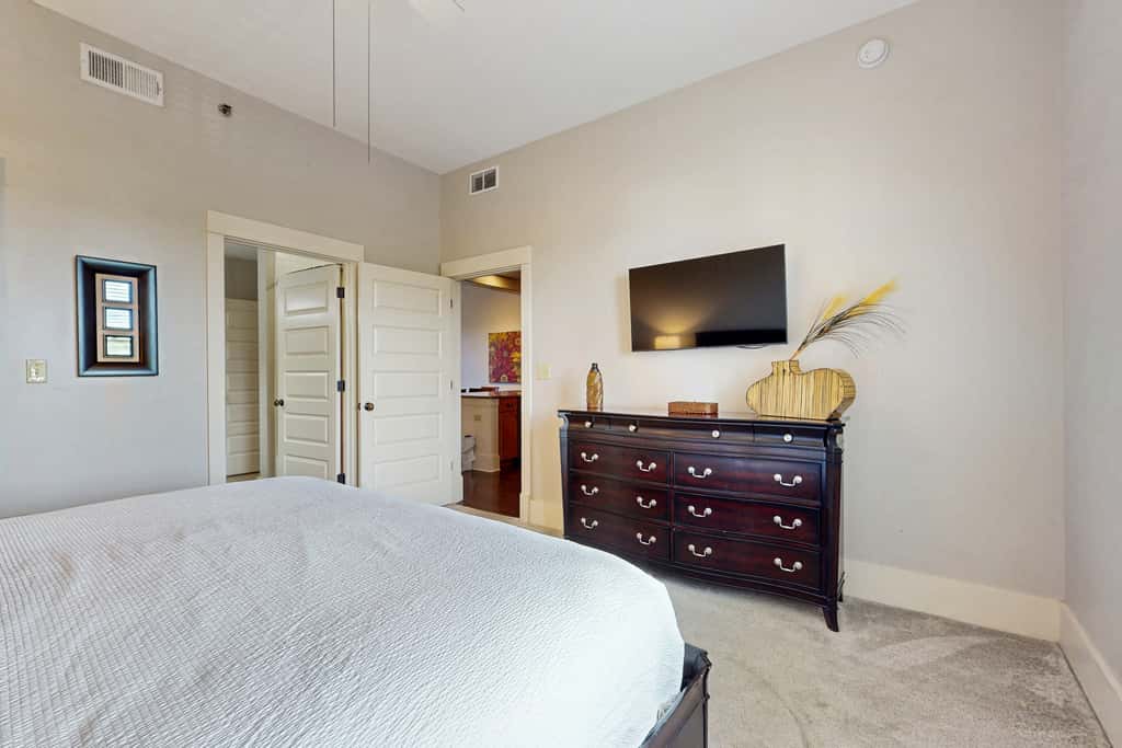 Polished condo with balcony & pools - one block from the beach