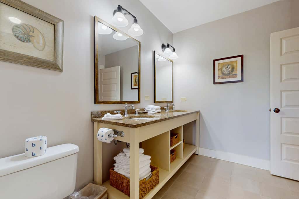 Polished condo with balcony & pools - one block from the beach