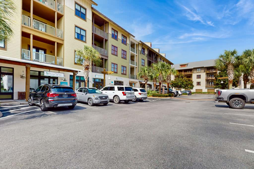 Polished condo with balcony & pools - one block from the beach