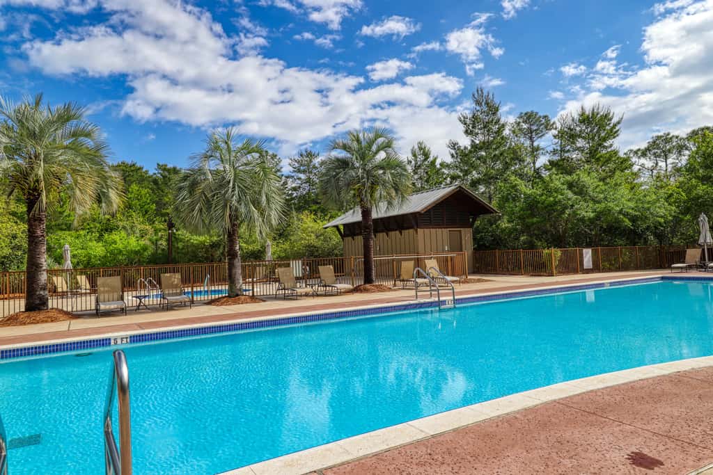 Polished condo with balcony & pools - one block from the beach