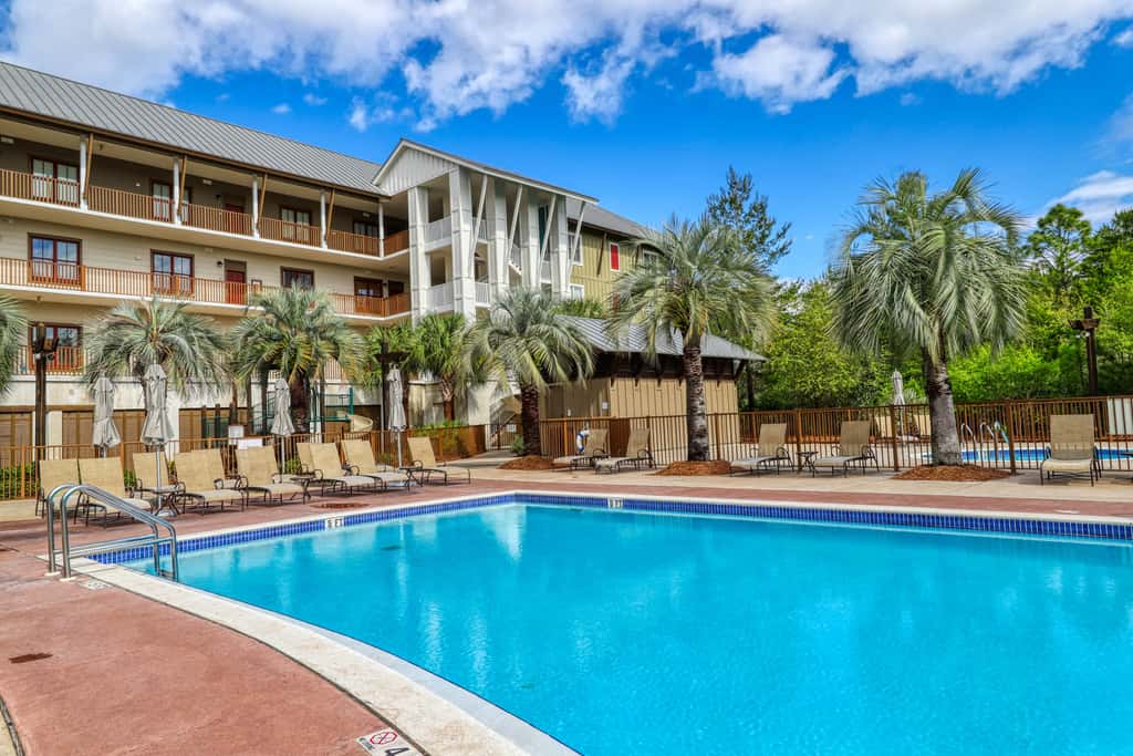 Polished condo with balcony & pools - one block from the beach