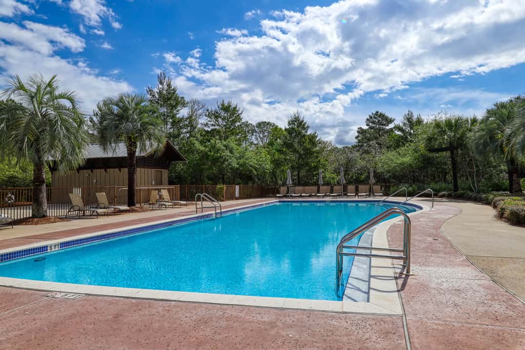Polished condo with balcony & pools - one block from the beach