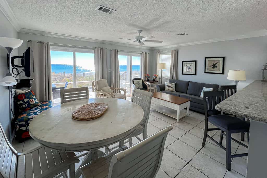 Lovely first floor condo with ocean views, patio, & grill - steps from the beach