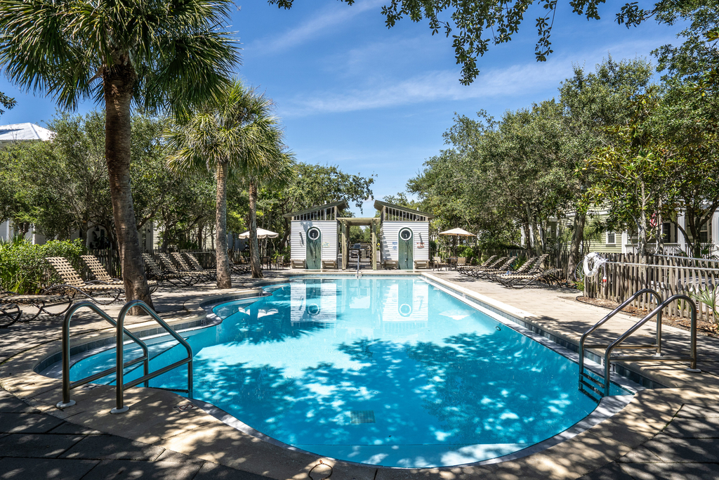 Modern coastal retreat with 2 balconies, grill, central AC, shared Pools, & WiFi