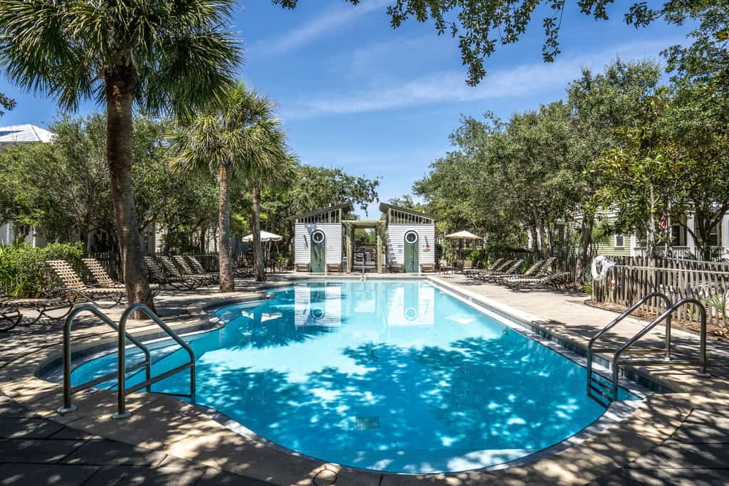 Modern coastal retreat with 2 balconies, grill, central AC, shared Pools, & WiFi