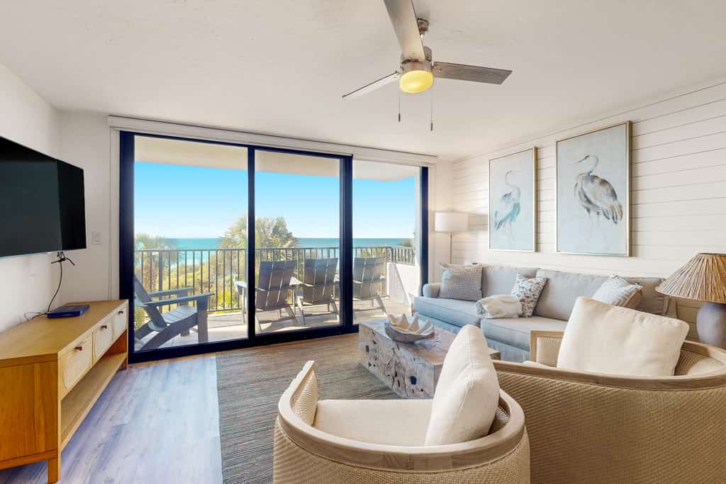 Second floor oceanfront condo with pool access, ocean view, WiFi, W/D, and AC
