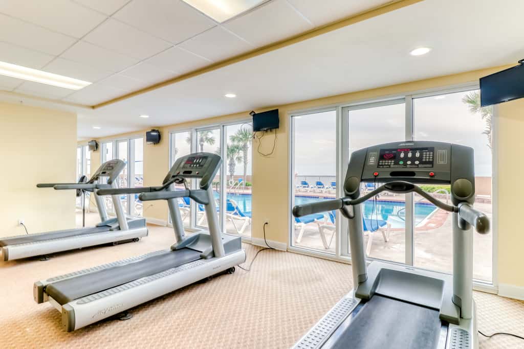 Elegant, beachfront condo with a furnished balcony, views & two pools