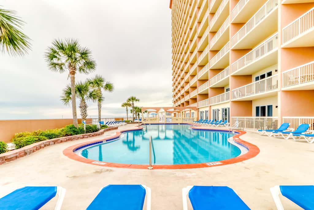 Elegant, beachfront condo with a furnished balcony, views & two pools
