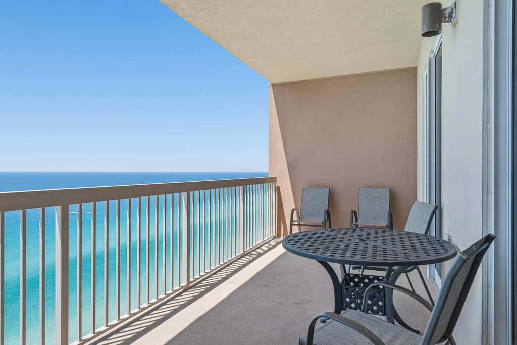 Elegant, beachfront condo with a furnished balcony, views & two pools