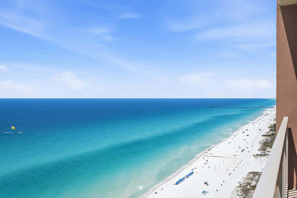 Elegant, beachfront condo with a furnished balcony, views & two pools